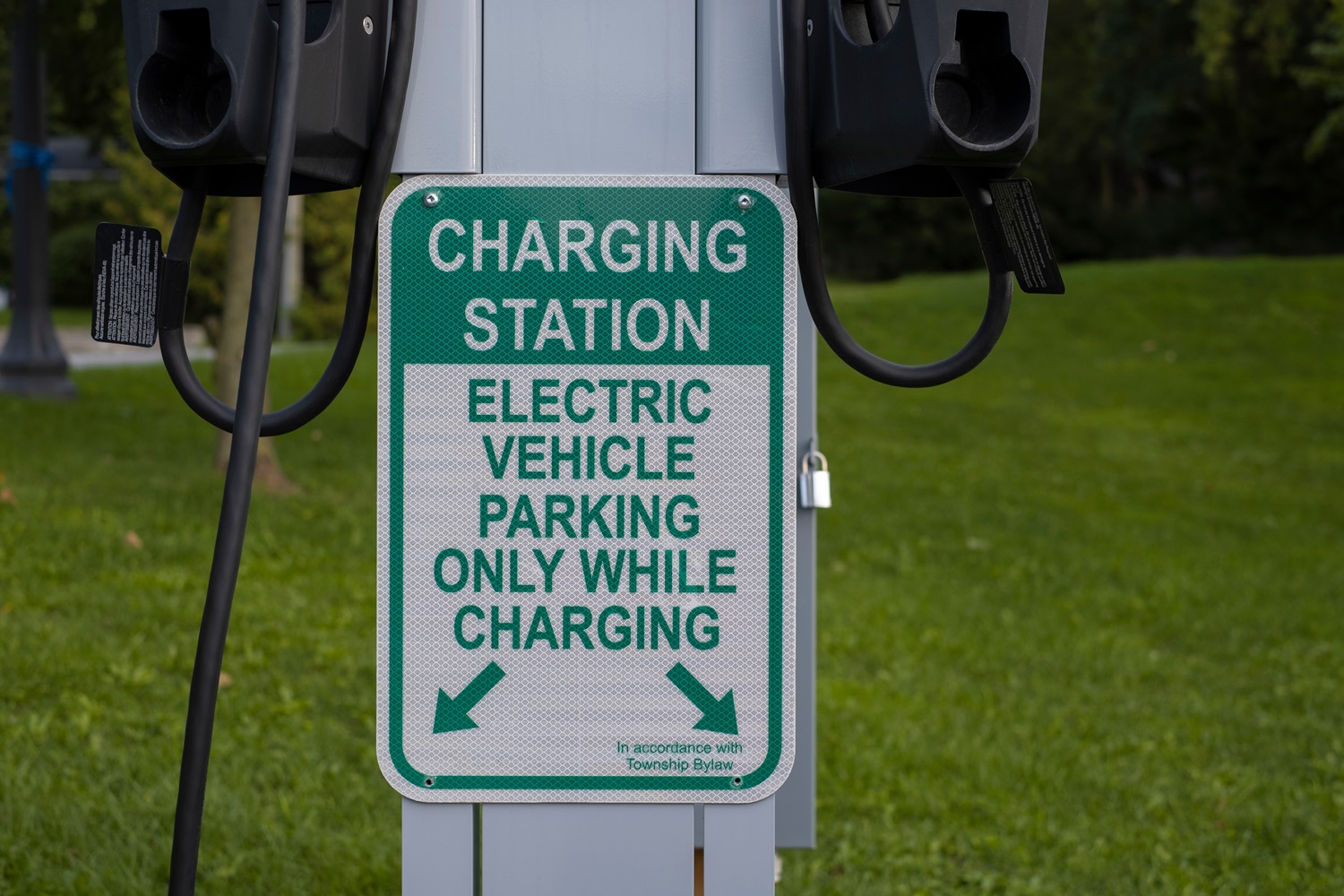 Sign charging station electric vehicle parking only while charging at.